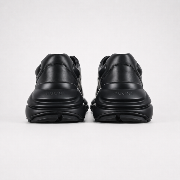 Gucci Rhyton Interlocking G Black sneaker, angled three-quarter view