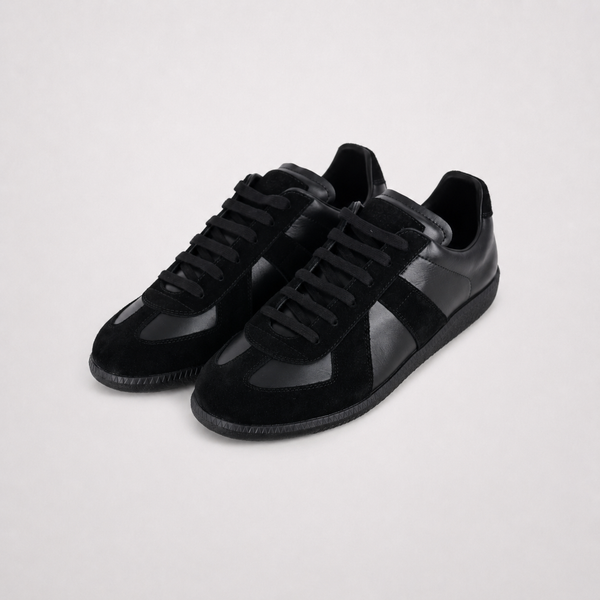 Maison Margiela Replica Black sneaker, angled three-quarter view